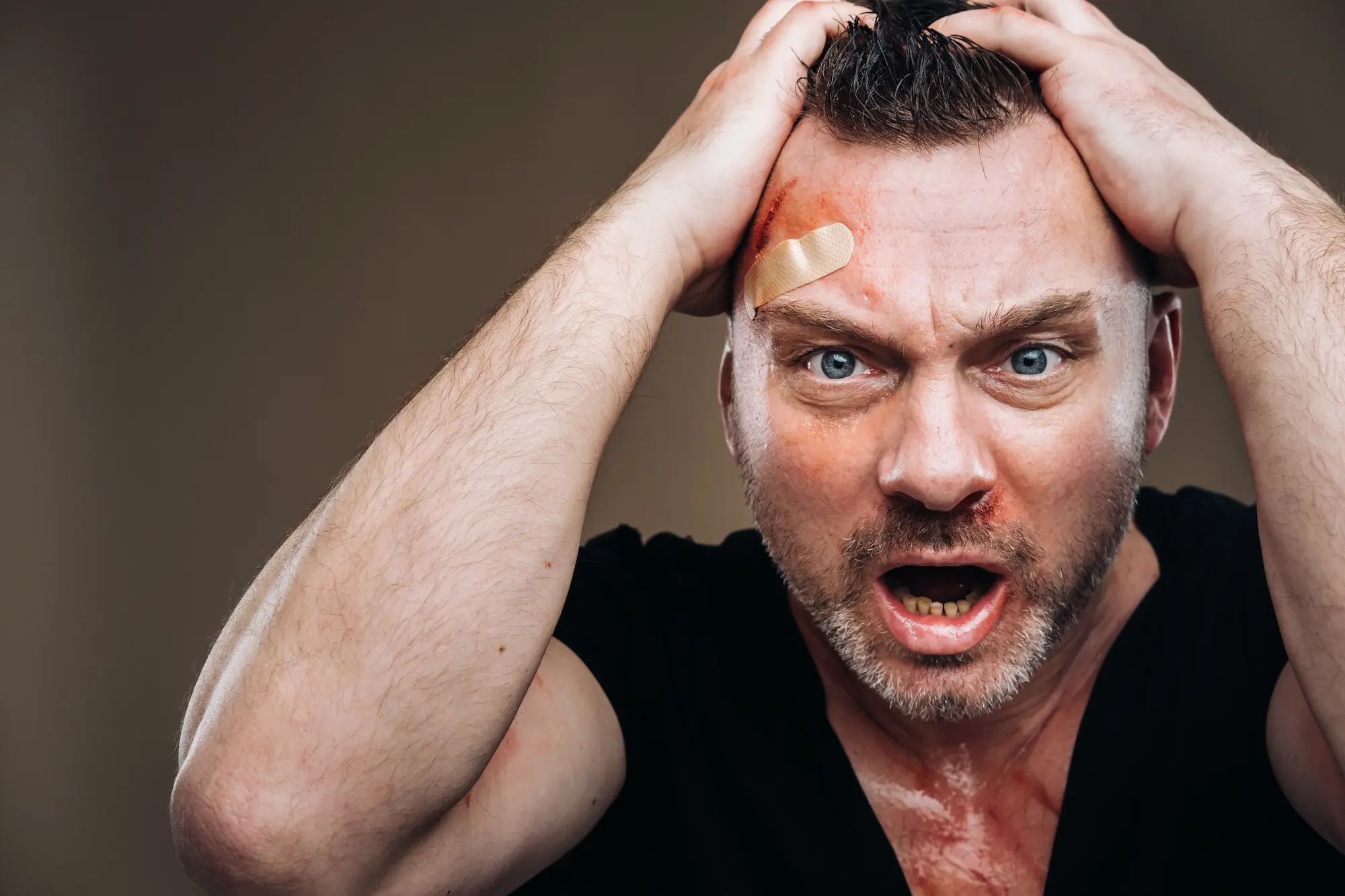 against-a-gray-background-stands-a-battered-angry-2025-03-24-11-07-29-utc